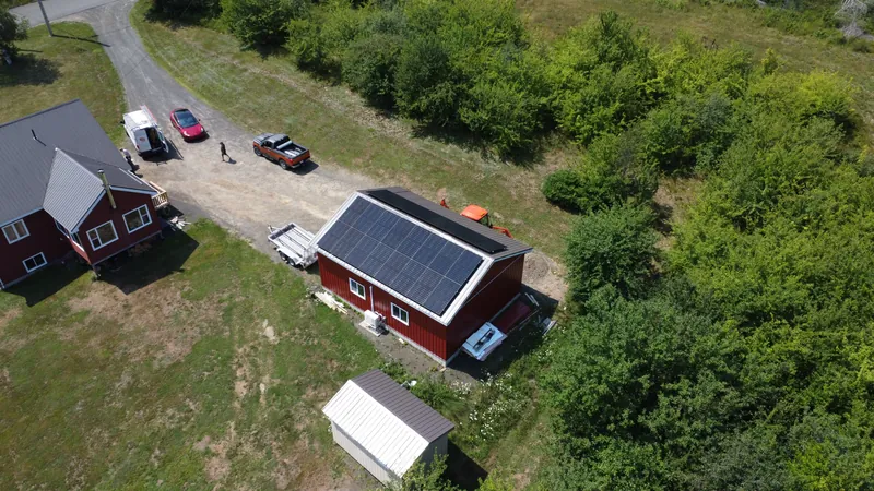 The Acaciaville property from above with the solar array and driveway in frame