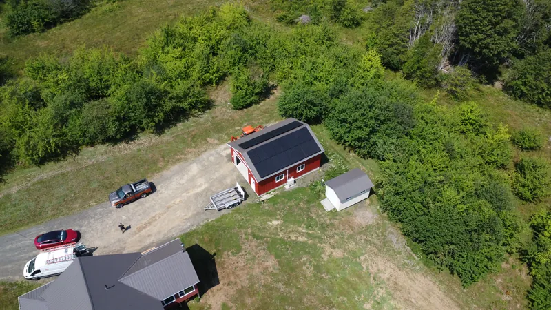 Side aerial view of the Acaciaville solar installation