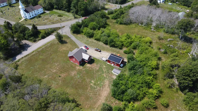 Wide aerial of the Acaciaville property set in the surrounding Annapolis Basin landscape