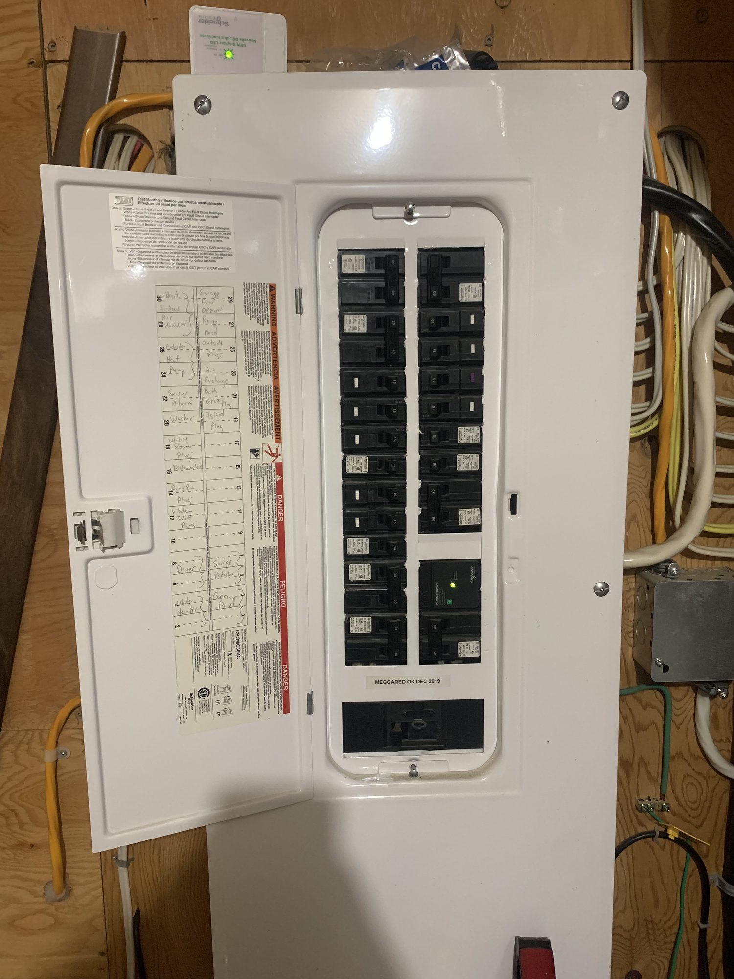 The home's original 200 amp electrical panel, kept in place for the 18 kW solar system