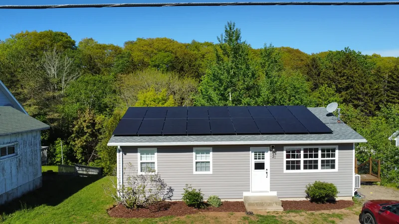 Front of the Digby home with the black solar array spanning the roofline