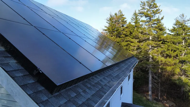 Close view of the black JA Solar modules and flush roof mounting