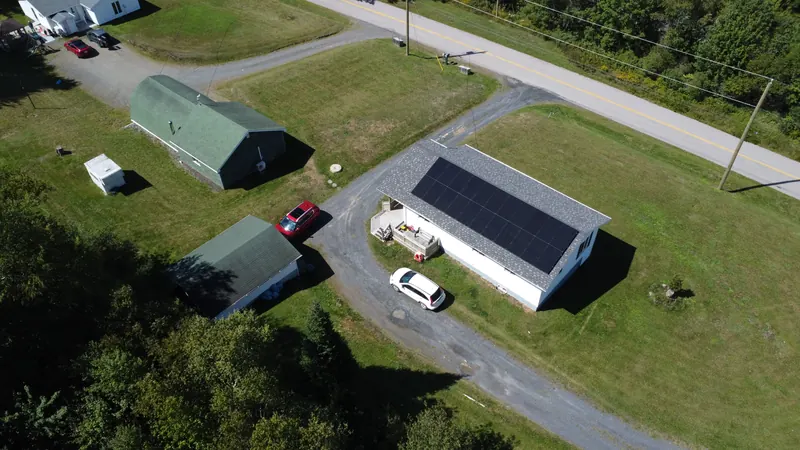 Wide aerial of the Marshalltown home set back from the road