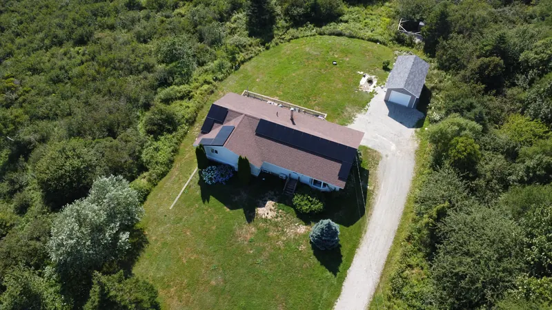 Rear aerial of the Saint Alphonse home surrounded by woodland