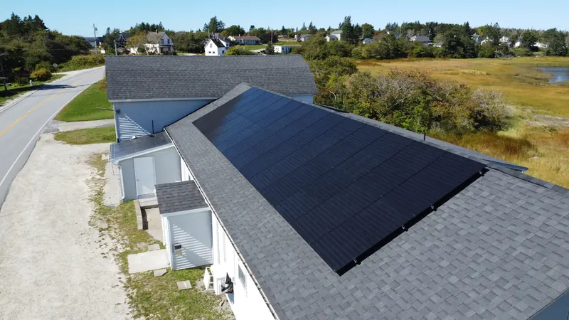The full run of black solar modules along the Surettes Island hall roof